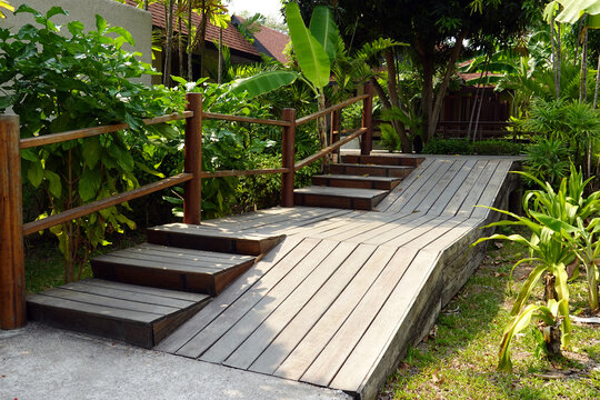 wood ramp pathway and stairs of entrance to house for disabled people.     