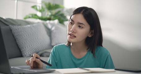 Pretty happy young entrepreneur woman working with laptop computer