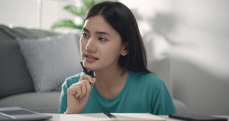 Pretty happy young entrepreneur woman working with laptop computer