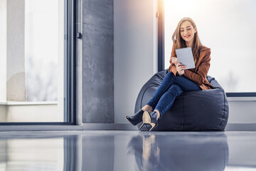 Shot of young entrepreneur woman working with tablet in the office