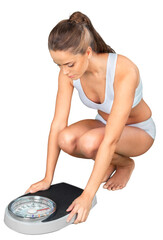 Portrait of a Fit Woman Looking a Weight Scale