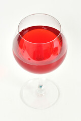 Premium red wine glass in white background