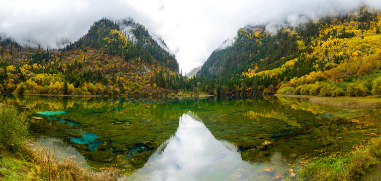 Colorful autumn in Jiuzhaigou National Park, Sichuan Province, China. UNESCO as a World Heritage Site. Panorama view