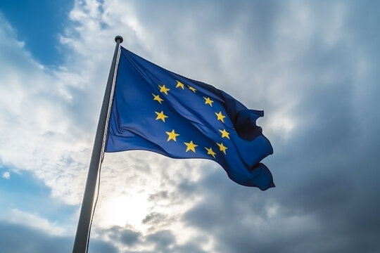 The flag of the European Union against the blue sky. 