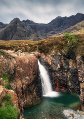 Fototapeta na wymiar Scotland - Fairy pools waterfall at sunirse in Isle of Skye, UK