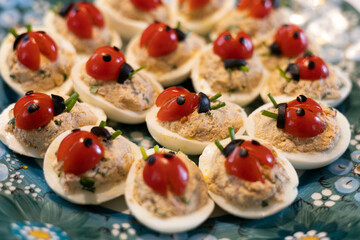 Easter stuffed eggs, polish traditional food, ladybird and flower shape, 