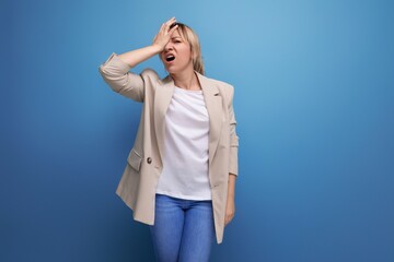 Fototapeta premium portrait of distressed european blond young business woman on studio background