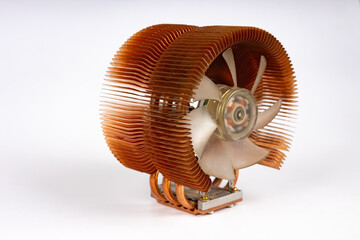 Active CPU cooler with large fin heatsink, fan, copper heat pipes and thermal pad, two coolers with copper finned heatsinks and fan on a white background