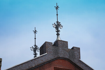 Lightning rod on roof of old building on sunny blue sky day - obrazy, fototapety, plakaty