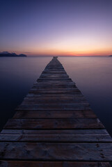 Fototapeta na wymiar pier at the beach during sunrise/sunset
