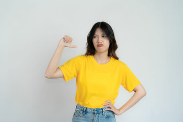 Fototapeta na wymiar Attractive Asian beautiful woman standing on white background and doing hand gestures.