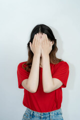 Attractive Asian beautiful woman standing on white background and doing hand gestures.