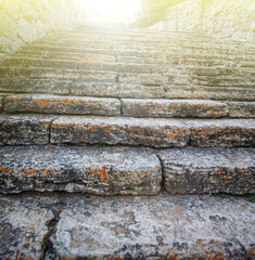 Old stone staircase in soft sunlight. Selective focus