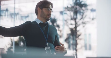 Portrait of a Teacher Giving Class to Diverse Group of Female and Male Students in College Room, Learning New Academic Skills on a Computer. Lecturer Shares Knowledge with Smart Young Scholars