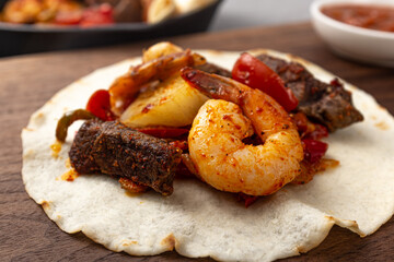 Fajitas, a food to eat meat, vegetables, and various ingredients wrapped in a tortilla