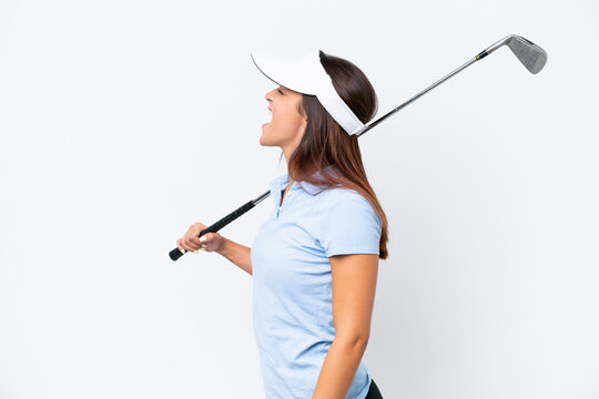 Young caucasian woman playing golf isolated on white background laughing in lateral position