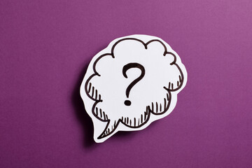 Question mark speech bubble of business concept on purple background.