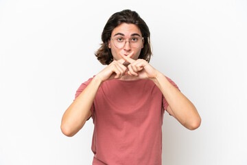 Young handsome man isolated on white background showing a sign of silence gesture
