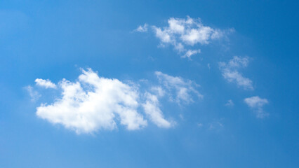 blue sky with white cloud background.