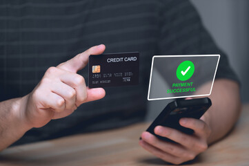 Businessman holding credit card and typing on laptop for online shopping and payment makes a purchase on the Internet, Online payment, Business financial and technology