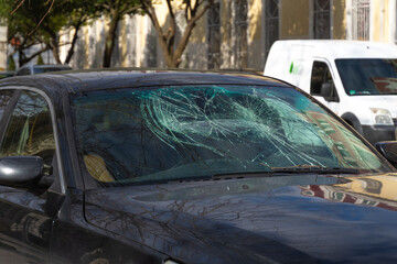 Broken windshield of the car. Car after an accident with a broken glass. Broken windshield after a...