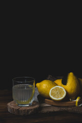 Close-up of lemons on a black background. Citrus fruits. Citrus mortise.