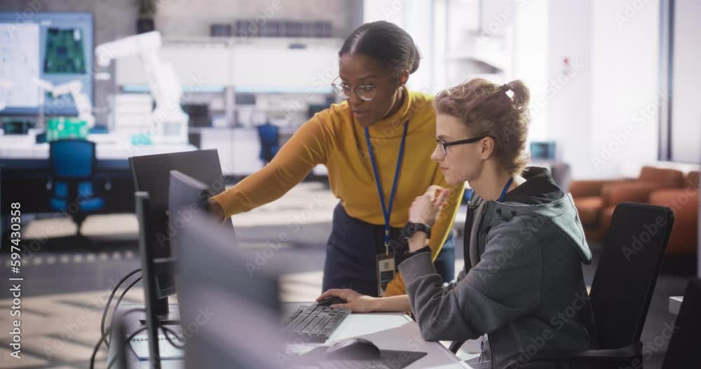 Aufkleber Diverse Multiethnic Team of Two Students Chatting in Computer Class, Preparing for Exams in School. Young Scholar Talking with a Teacher About Creating an Online Research Project About AI Safety