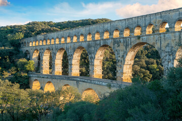 The "Pont du Gard" is an ancient Roman aqueduct bridge built in the first century AD to carry water (31 mi) .It was added to UNESCO's list of World Heritage  Sites in 1985