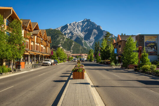 BANFF, ALBERTA, CANADA - JUNE 27, 2017 : Scenic street view of the Banff Avenue in a sunny summer day. Banff is a resort town and popular tourist destination.