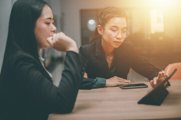 Businesswoman of senior management colleagues at meeting Professional businessmen work together on a SWOT analysis plan in a conference room via laptop.
