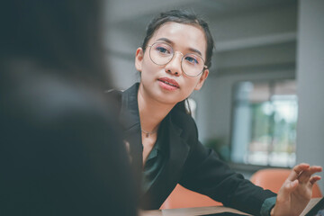 Businesswoman of senior management colleagues at meeting Professional businessmen work together on...