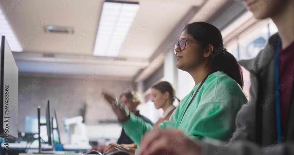 Poster young indian female student studying in university with diverse multiethnic classmates. she raises h
