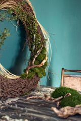 Close-up of home wall decor made of natural materials.A fragment of a wreath of twigs,...