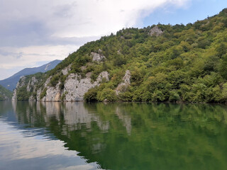 Fototapeta na wymiar banks of river Drina with cloudy sky