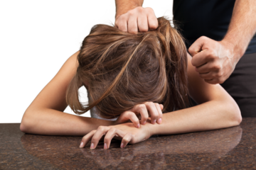 Woman covering face in fear of domestic violence