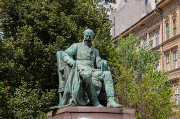 Bronze statue of the famous Hungarian writer Jókai Mór, in the old town of Budapest, Hungary,...