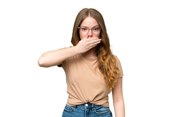 Fototapeta premium Young pretty woman over isolated background covering mouth with hand