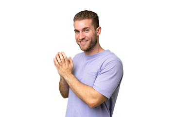 Young handsome caucasian man isolated on green chroma background scheming something
