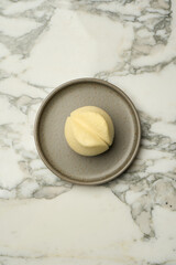 Tulip shape candy dessert on plate, close-up