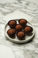 Chocolate Truffle candy on a white plate