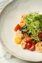 Healthy seafood salad with shrimps and fresh vegetables,