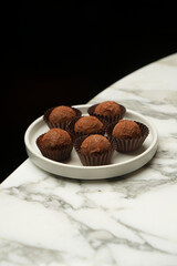 Chocolate Truffle candy on a white plate