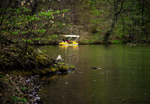 Beautiful spring landscape. Parz Lich (Clear Lake) by boats and forest, Armenia