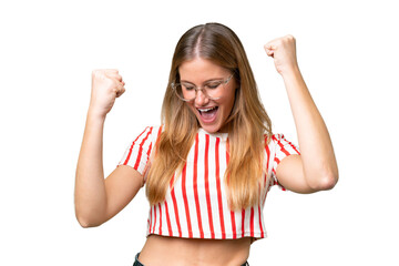 Young beautiful woman over isolated background celebrating a victory
