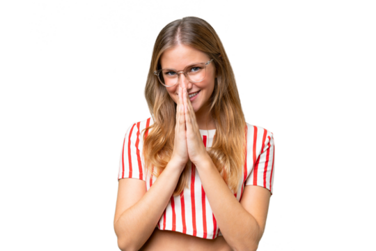 Young beautiful woman over isolated background keeps palm together. Person asks for something