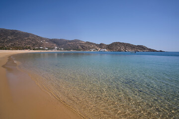 View of the beautiful turquoise sandy beach of Mylopotas in Ios Greece