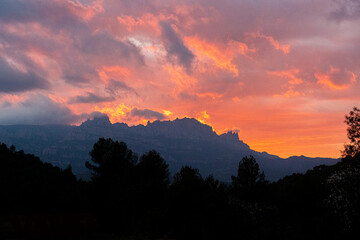 Sunset with red sky overlooking the Montserrat mountain