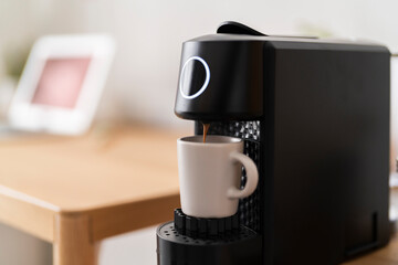 capsule coffee machine while preparing an espresso