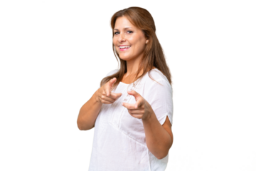 Middle-aged caucasian woman over isolated background pointing to the front and smiling