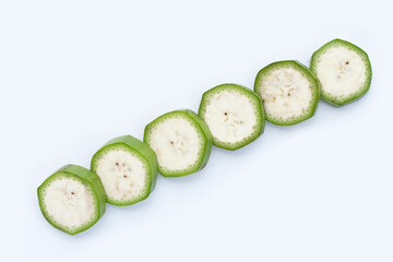 Raw banana slices on white background.